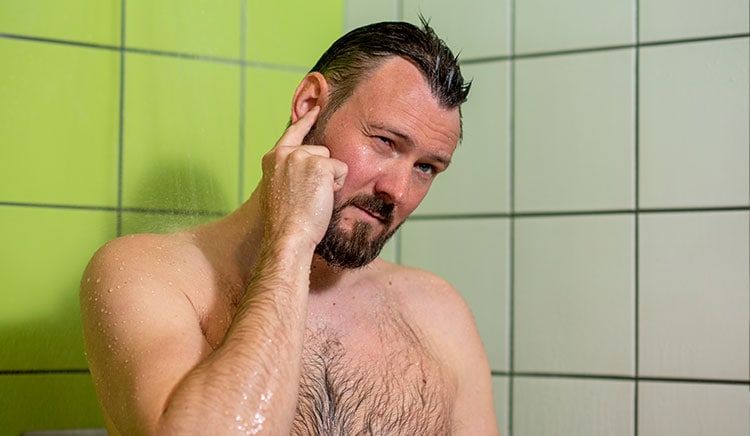 Man with itchy ear